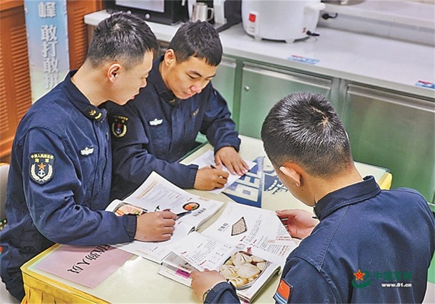 PLA Navy personnel study menus for open-ocean operations